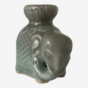 Porcelain candle holder and celadon cover in the shape of an elephant