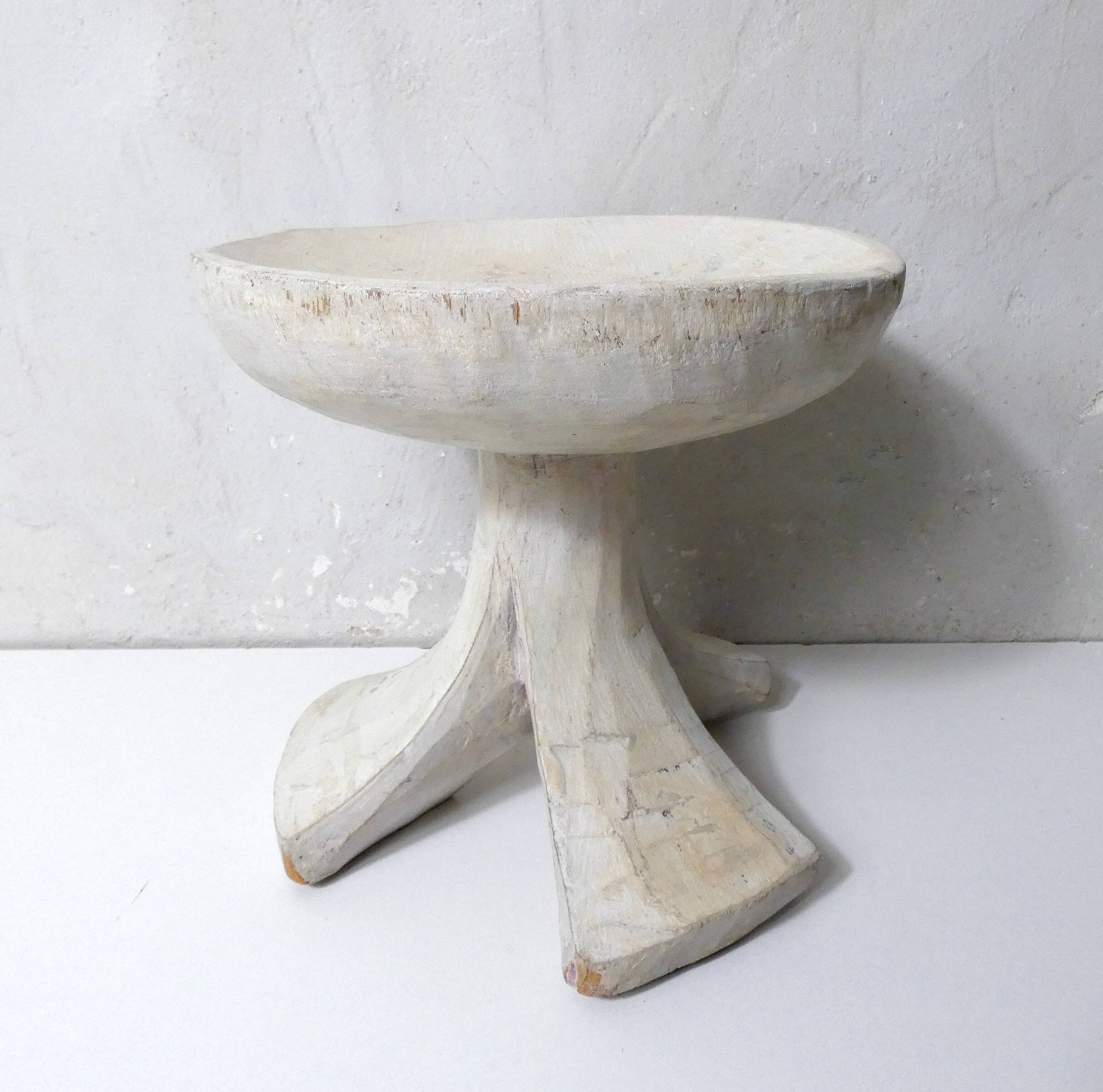 antique small tripod bench/stool in solid carved brutalist wood