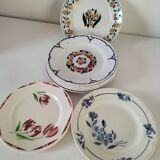 Set of 8 ironstone plates with coordinated designs.