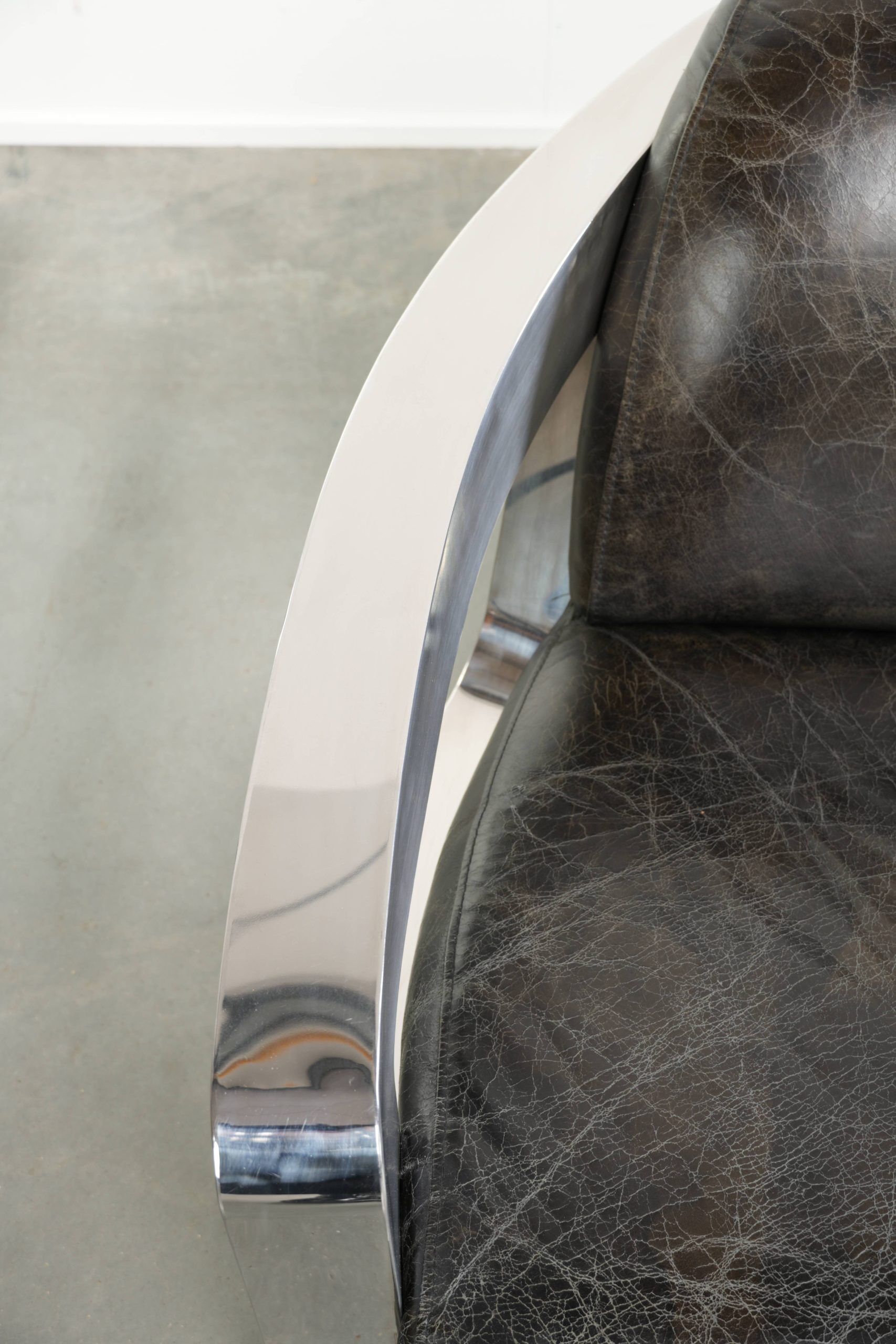 Industrial Aviator design armchair in cowhide finished with aluminium