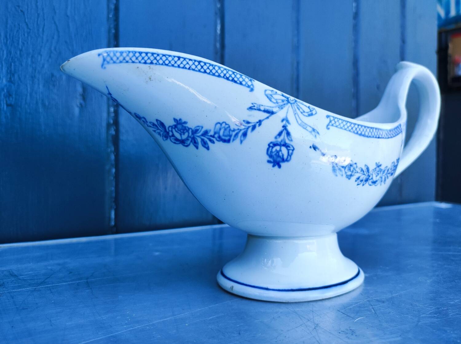 Old earthenware sauce boat