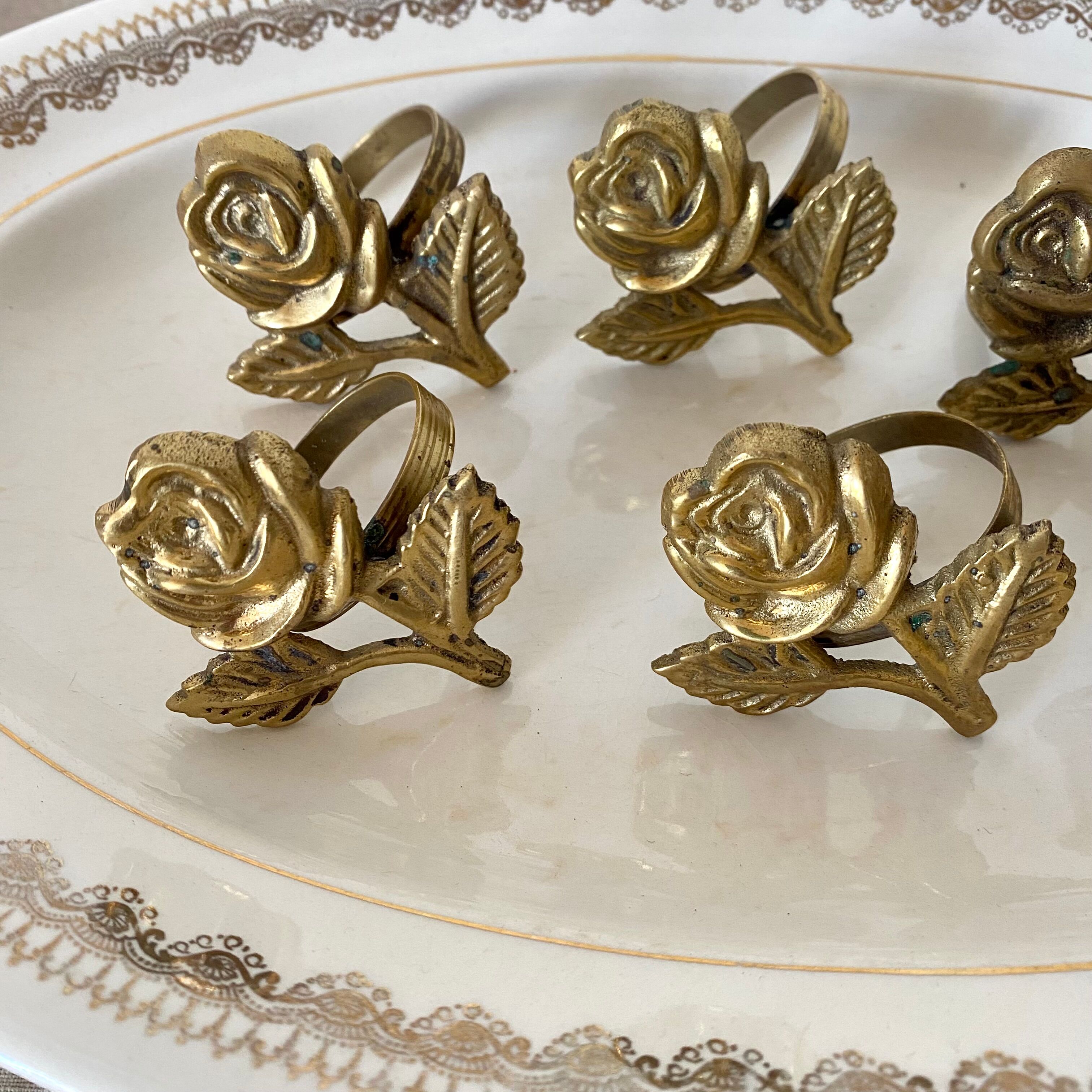 Golden brass napkin rings
