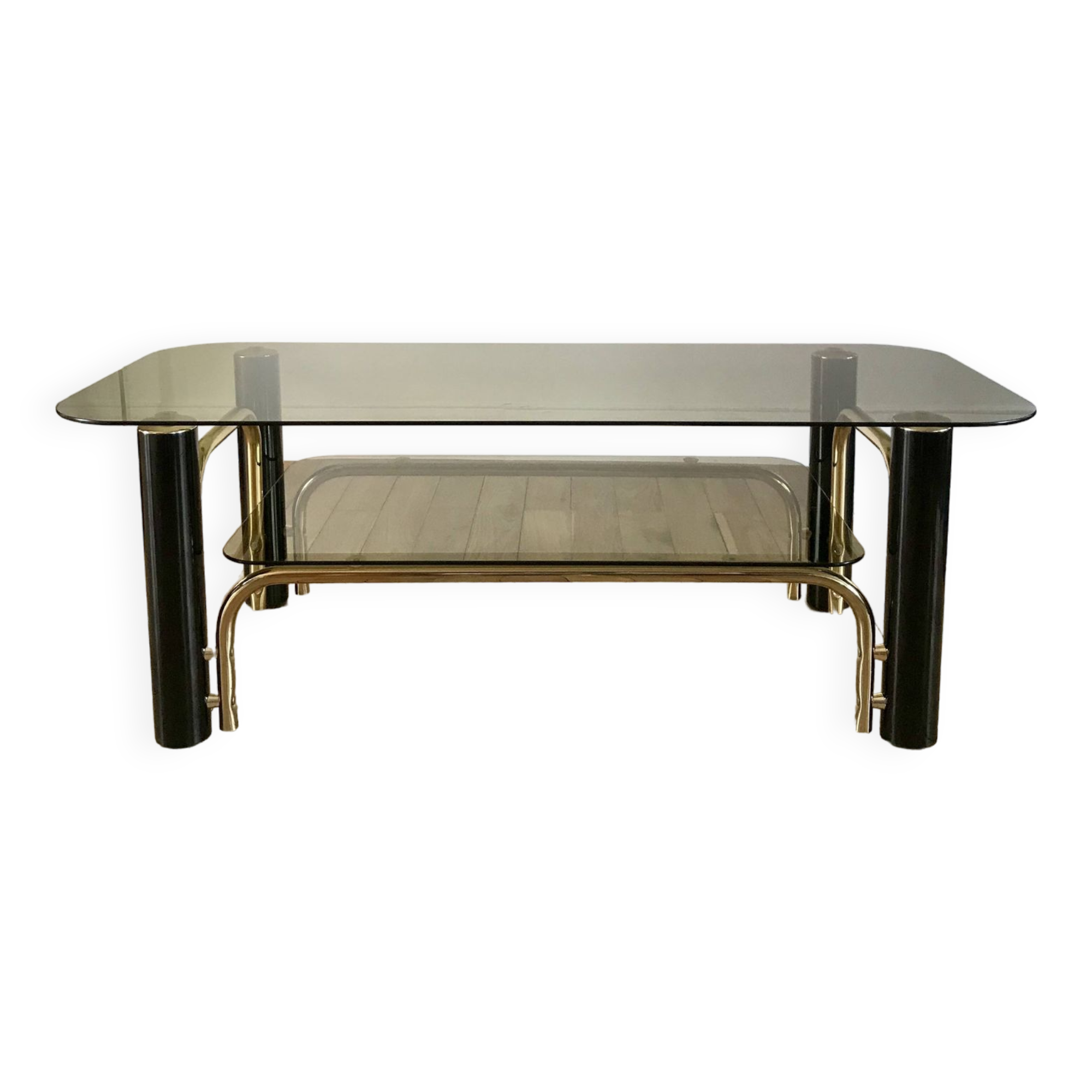 coffee table in smoked glass and black and gold metal from the 70s