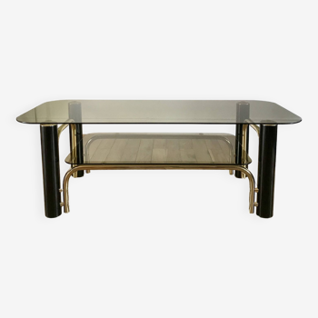 coffee table in smoked glass and black and gold metal from the 70s