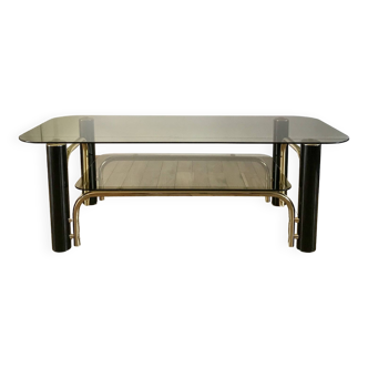 coffee table in smoked glass and black and gold metal from the 70s