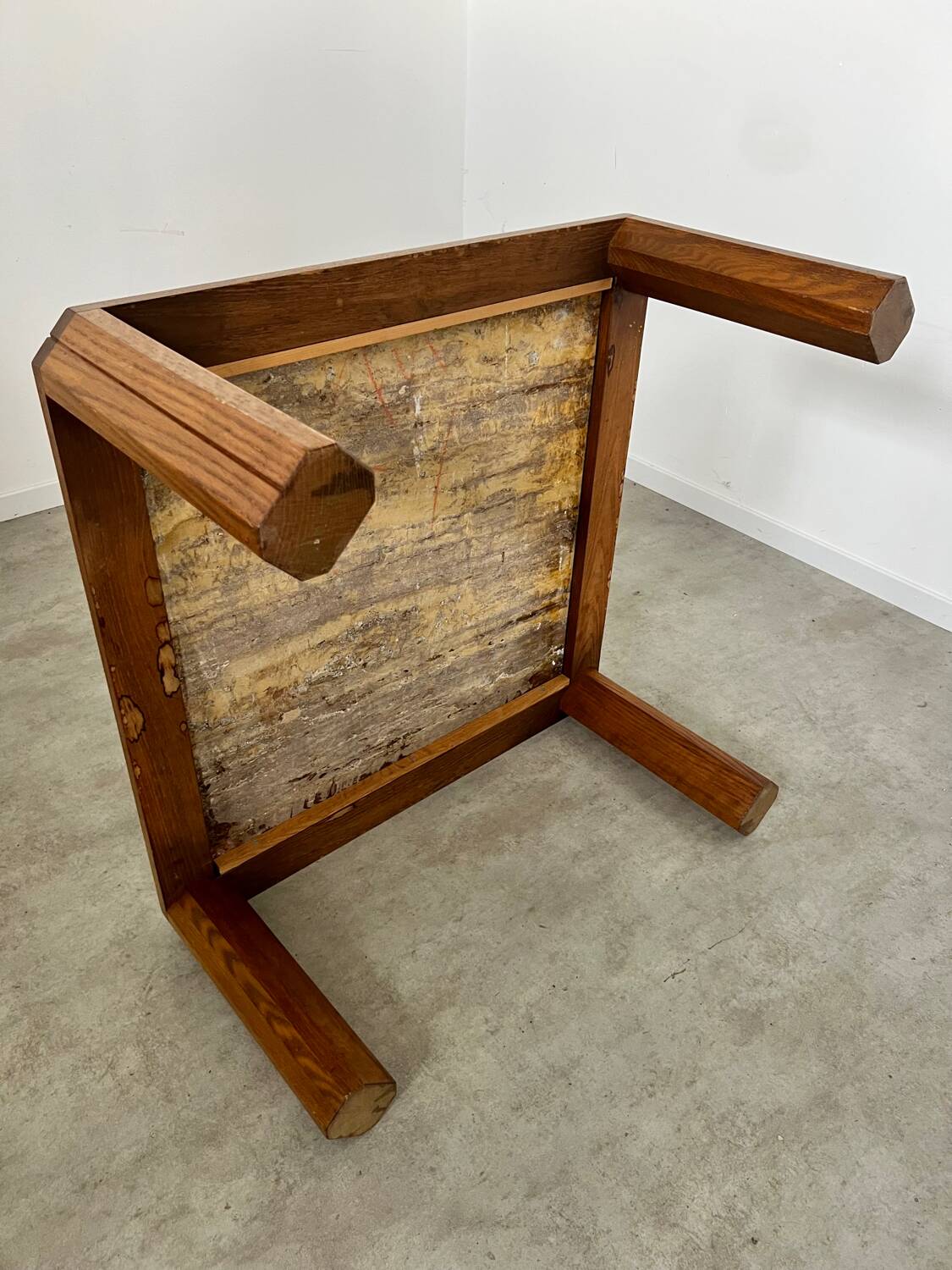 Old coffee table with golden marble top, 70s design, vintage wooden feet