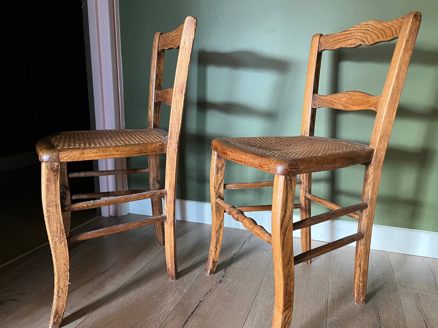 Pair of vintage chairs from the late 20th century with caning.