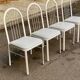 4 chaises en acier blanc et cuir gris