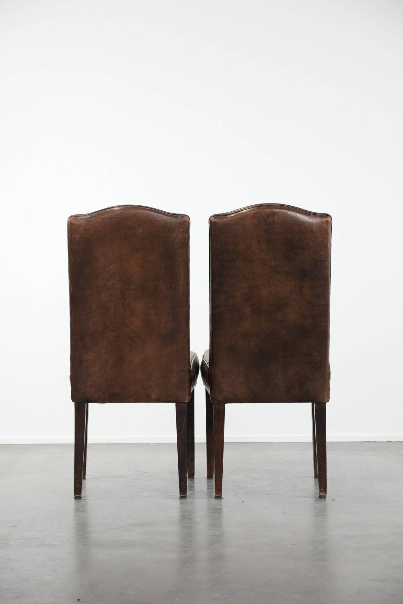 Set of 6 vintage sheepskin dining chairs finished with black piping