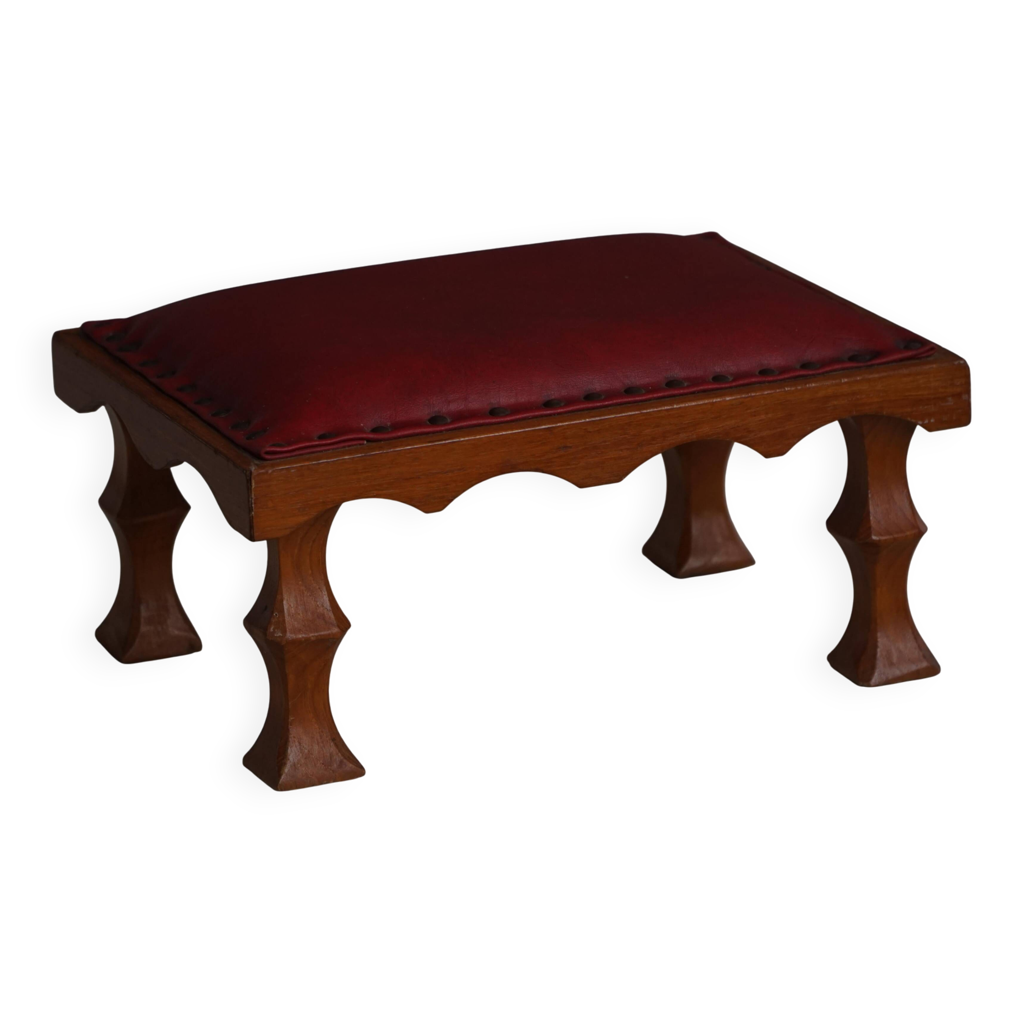 Danish sculpted oak stool from the mid-20th century with a red leather seat, 1950s.