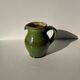 Green glazed ceramic pitcher