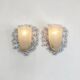 Wrought iron pocket wall sconces featuring a frosted amber glass / metal frame