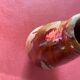 Large antique pottery bottle in glazed terracotta with drips.
