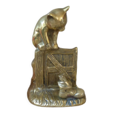 Golden brass cat figurine on fence looking at a mouse in a Vintage India shoe