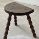 Two French farmhouse stools made of turned wood.