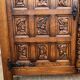 Spanish furniture with carved wood profiles and coats of arms from the 1950s.