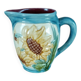 Majolica earthenware pitcher from France. Sunflower in slip