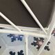Vintage white metal Croisette style armchairs with hairpin legs in superb condition