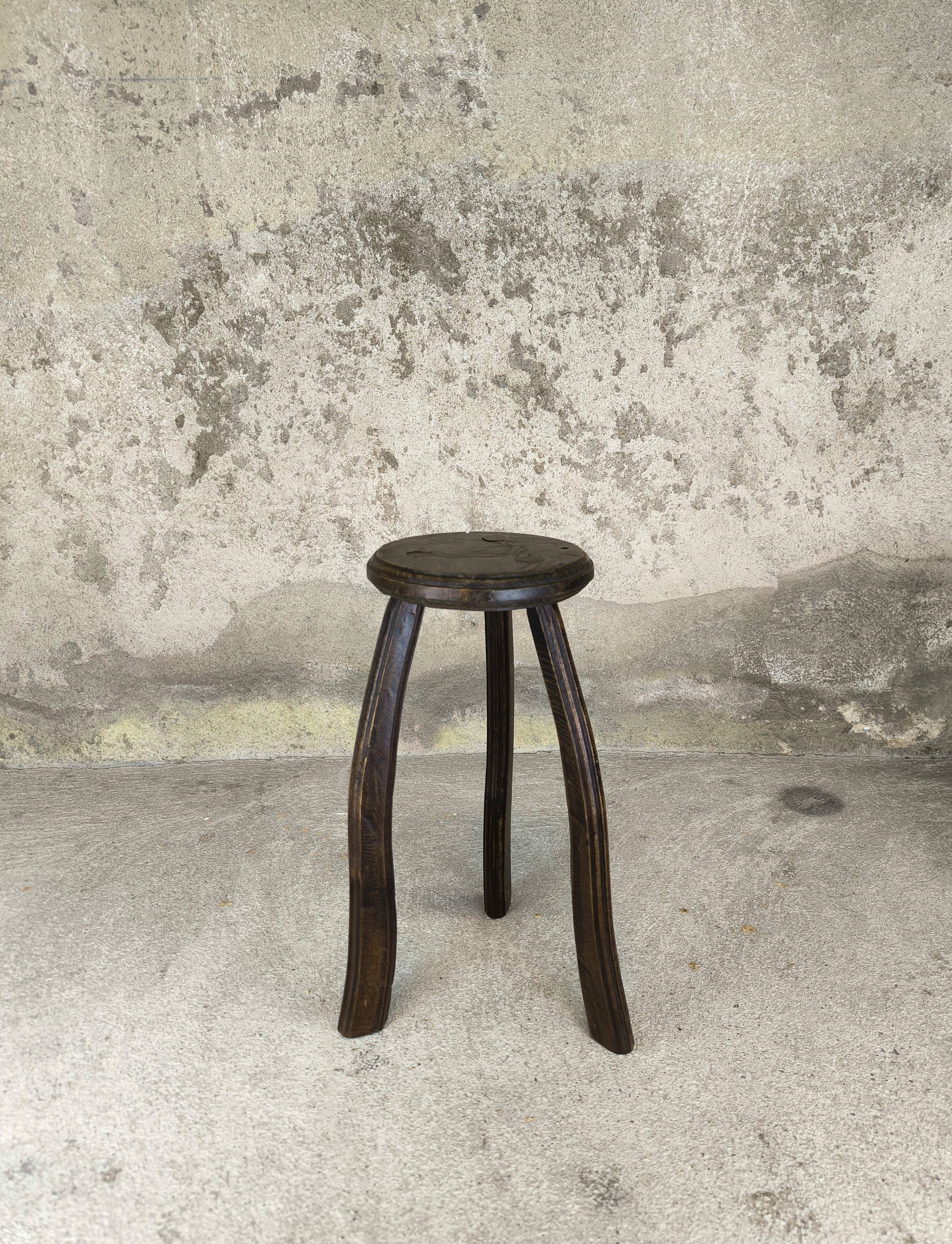 Vintage tripod plant stand with curved legs.