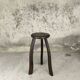 Vintage tripod plant stand with curved legs.