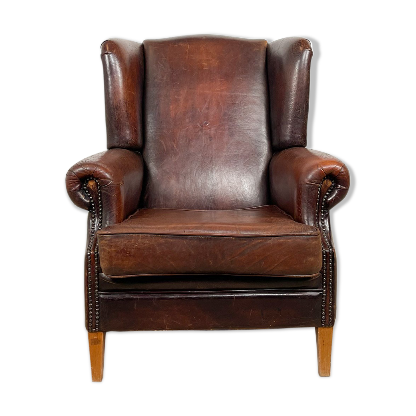 Dark brown vintage sheep leather wingback armchair