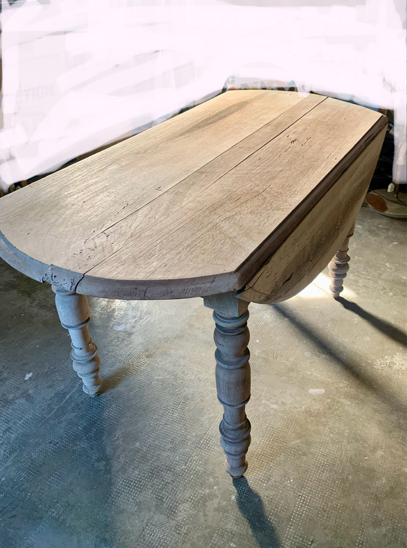 Oval drop-leaf table