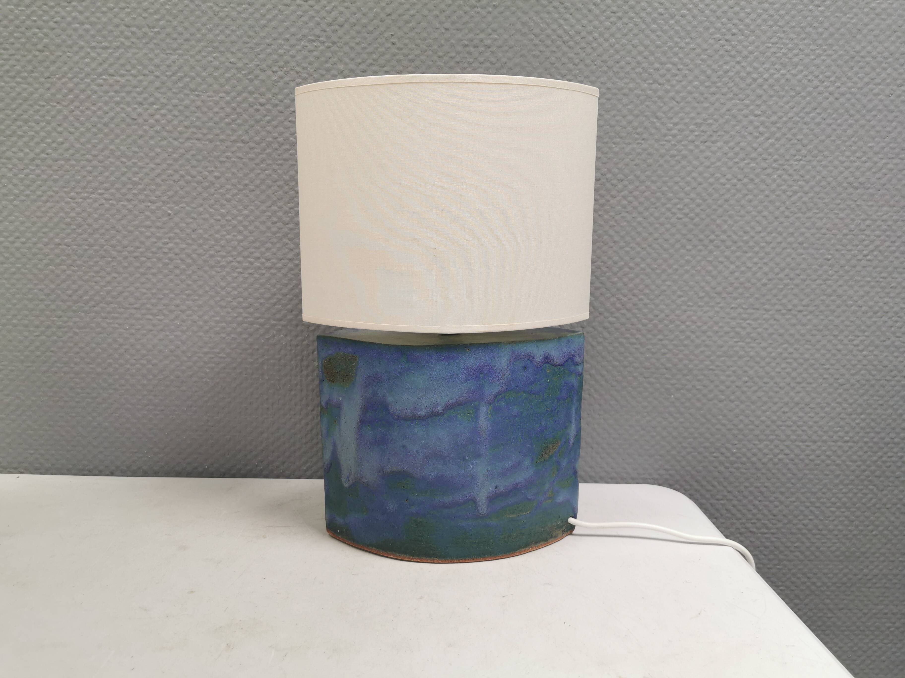 Sculptural table lamp in blue glaze with an abstract expression.