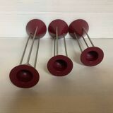 Trio of vintage burgundy candlesticks