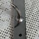 Stainless steel butcher's hook, known as a "wolf tooth bar."