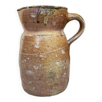 Old pitcher in pyreted sandstone