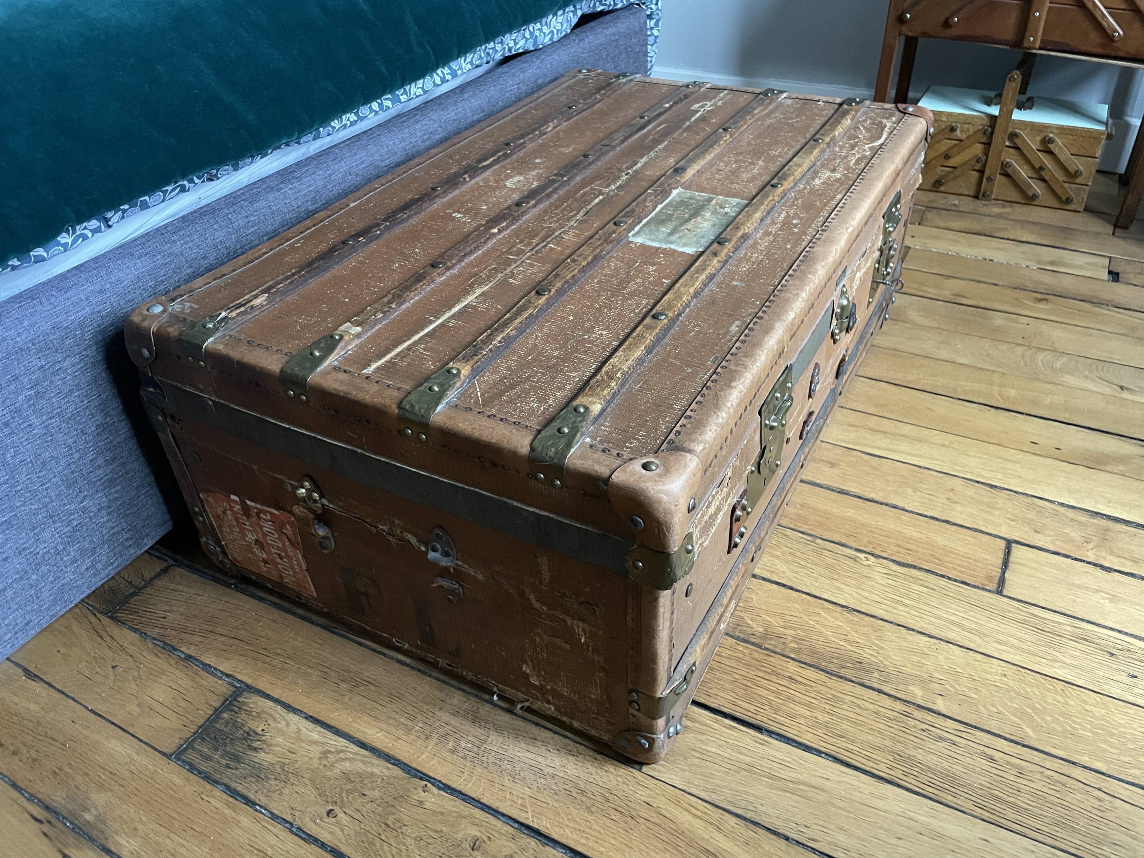 Large antique trunk with a key closure.