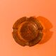 Empty chiseled pocket in amber glass