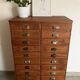 Old apothecary trade furniture in vintage wood 24 drawers.