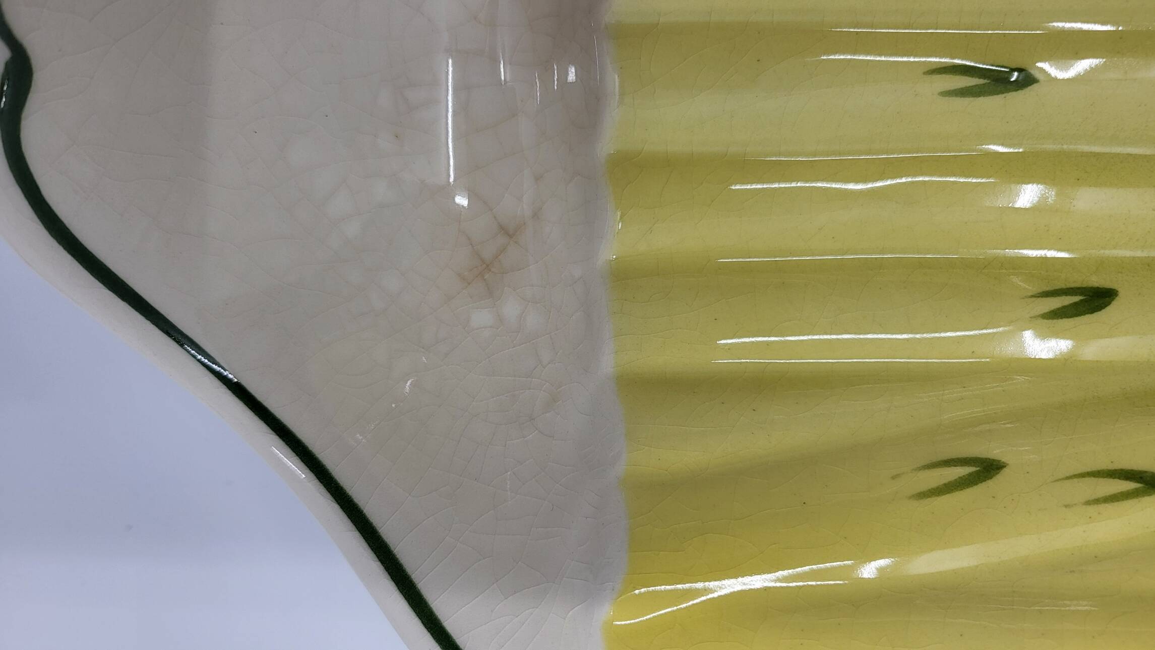 Salins earthenware slip dish decorated with asparagus, French, yellow and green, 20th century