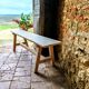 Rustic, raw solid oak bench.