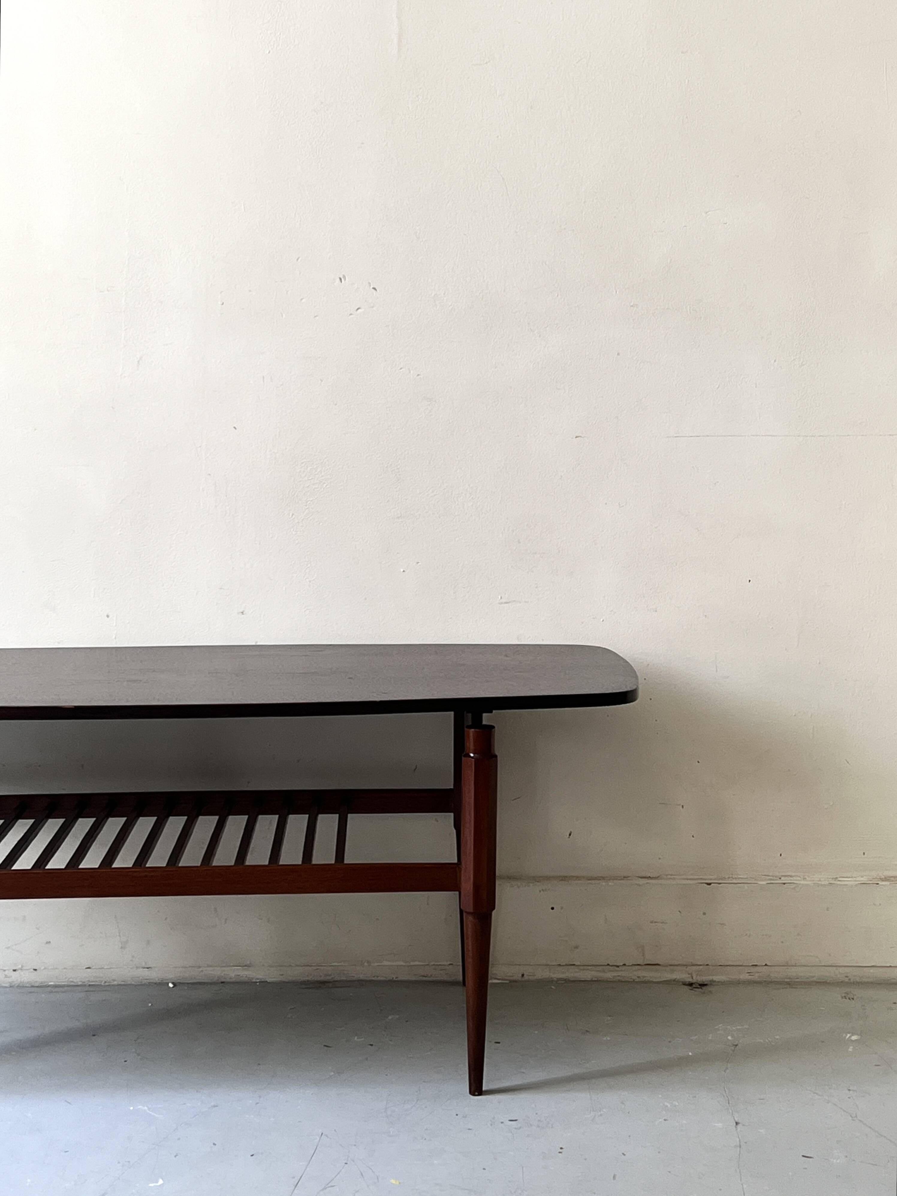 Danish teak coffee table with a double top, 1950s design.