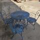 Ensemble de jardin 4 fauteuils et une table en fer forgé
