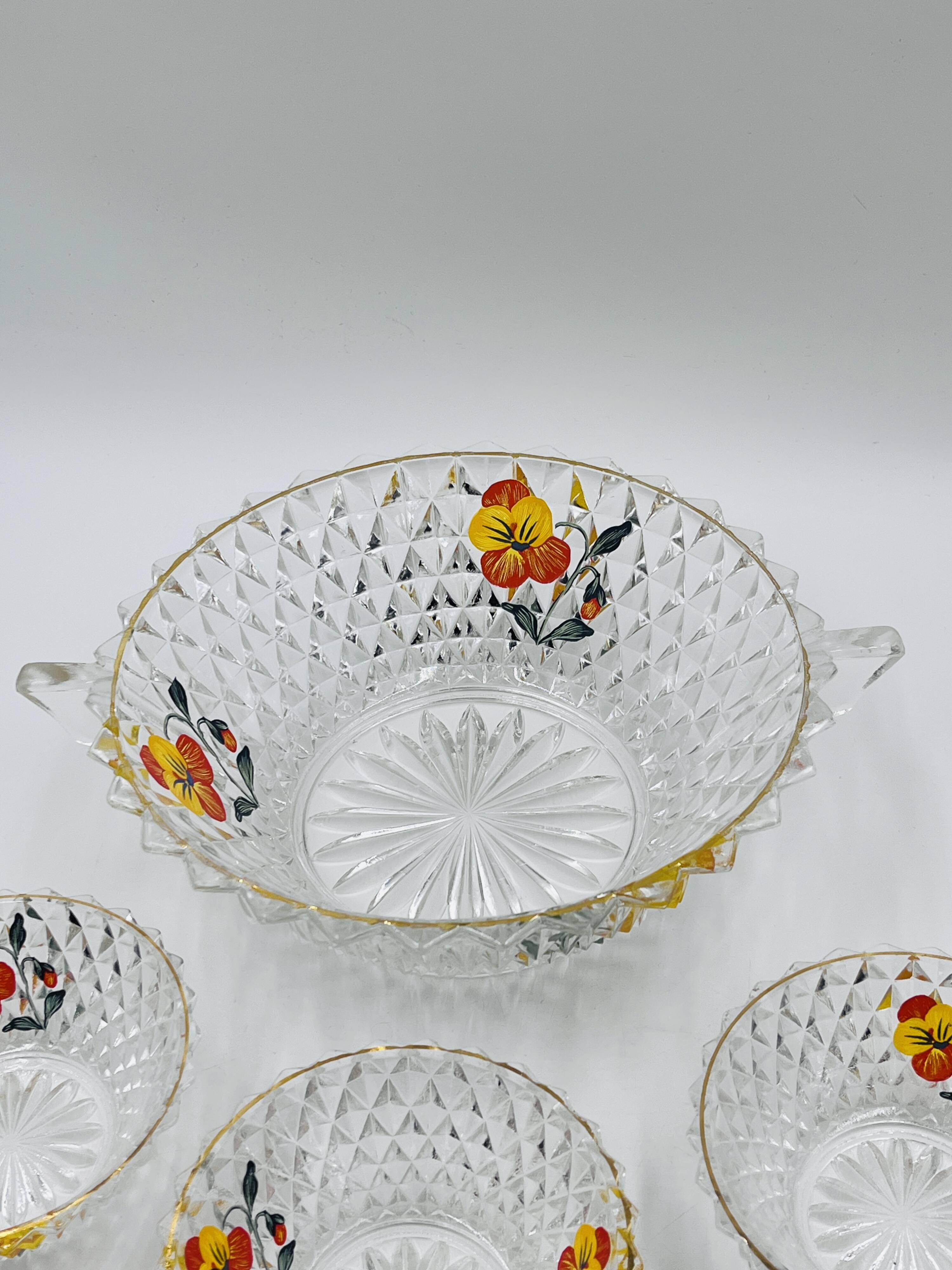 Vintage glass fruit salad serving set with a pansy design.