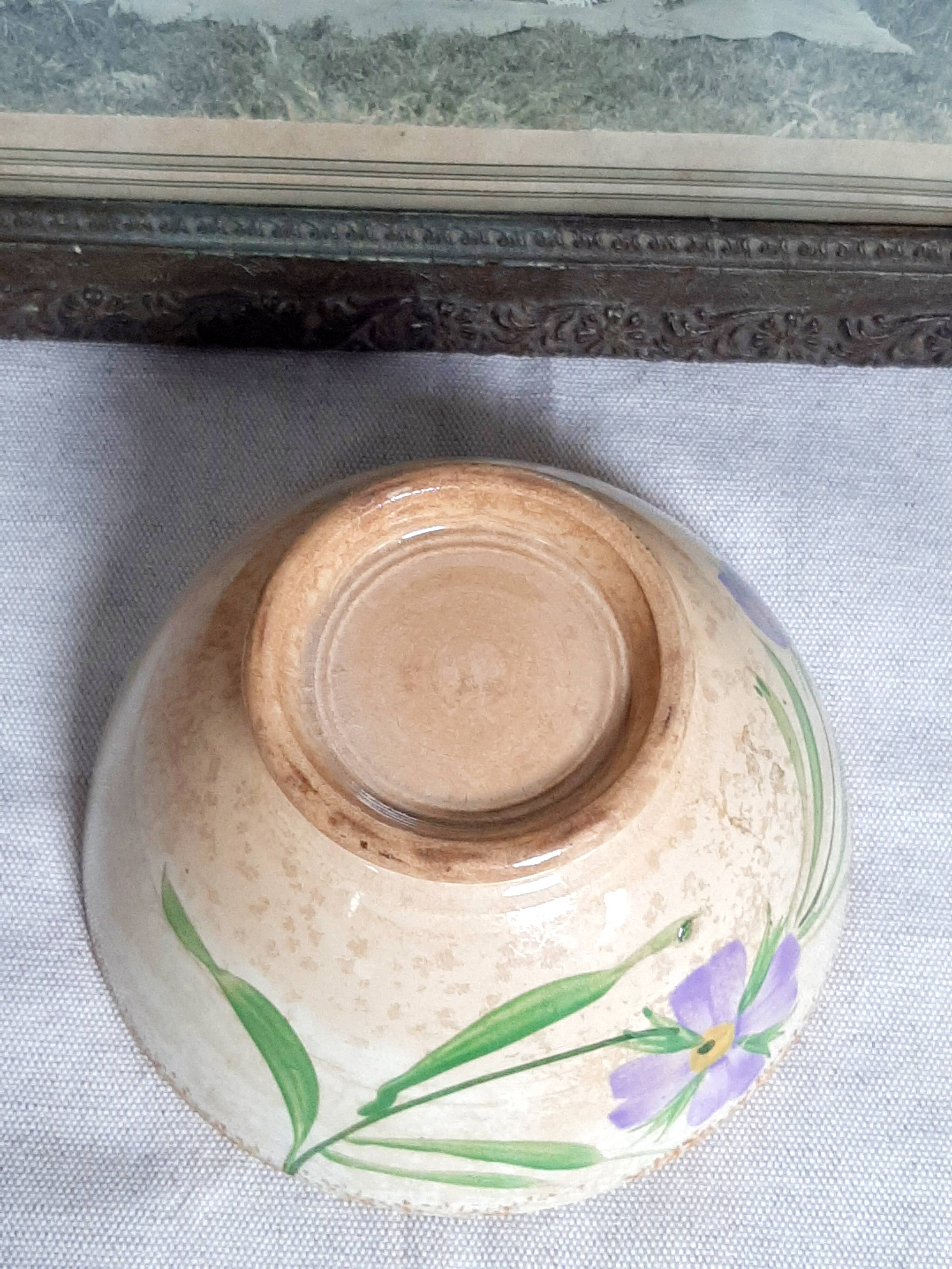 Old bowl in earthenware with floral decoration.