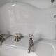 Set of a sink and its retro ceramic splashback.