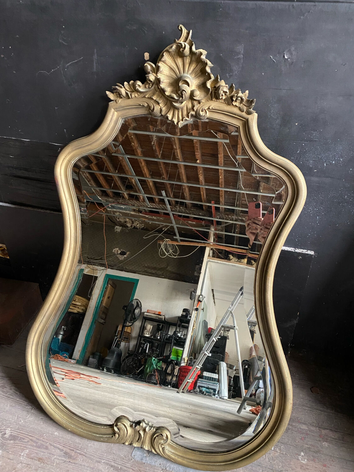 Antique bevelled baroque mirror in patinated wood
