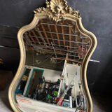 Antique bevelled baroque mirror in patinated wood