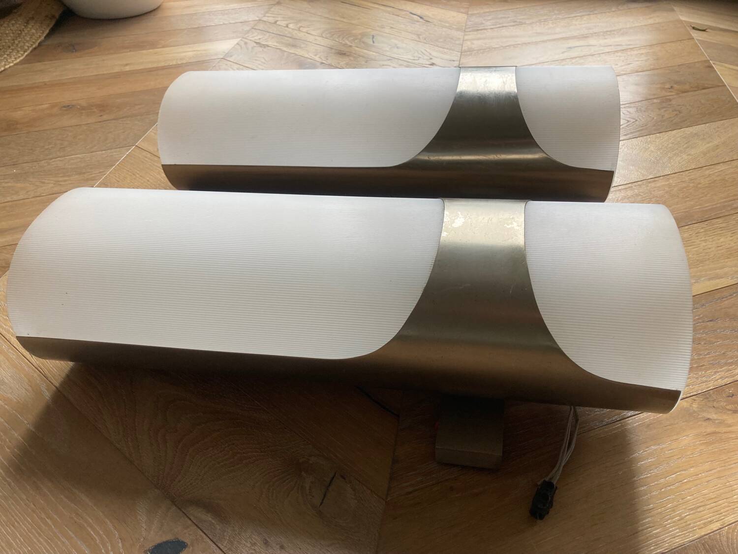 Brushed metal and ribbed opal plastic wall lights