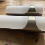 Brushed metal and ribbed opal plastic wall lights