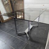 Chromed metal table with smoked glass top