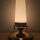 Pair of Hollywood Regency table lamps in brass with glass shades.