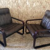 Pair of vintage armchairs in curved wood with suspended seat circa 1970-80.