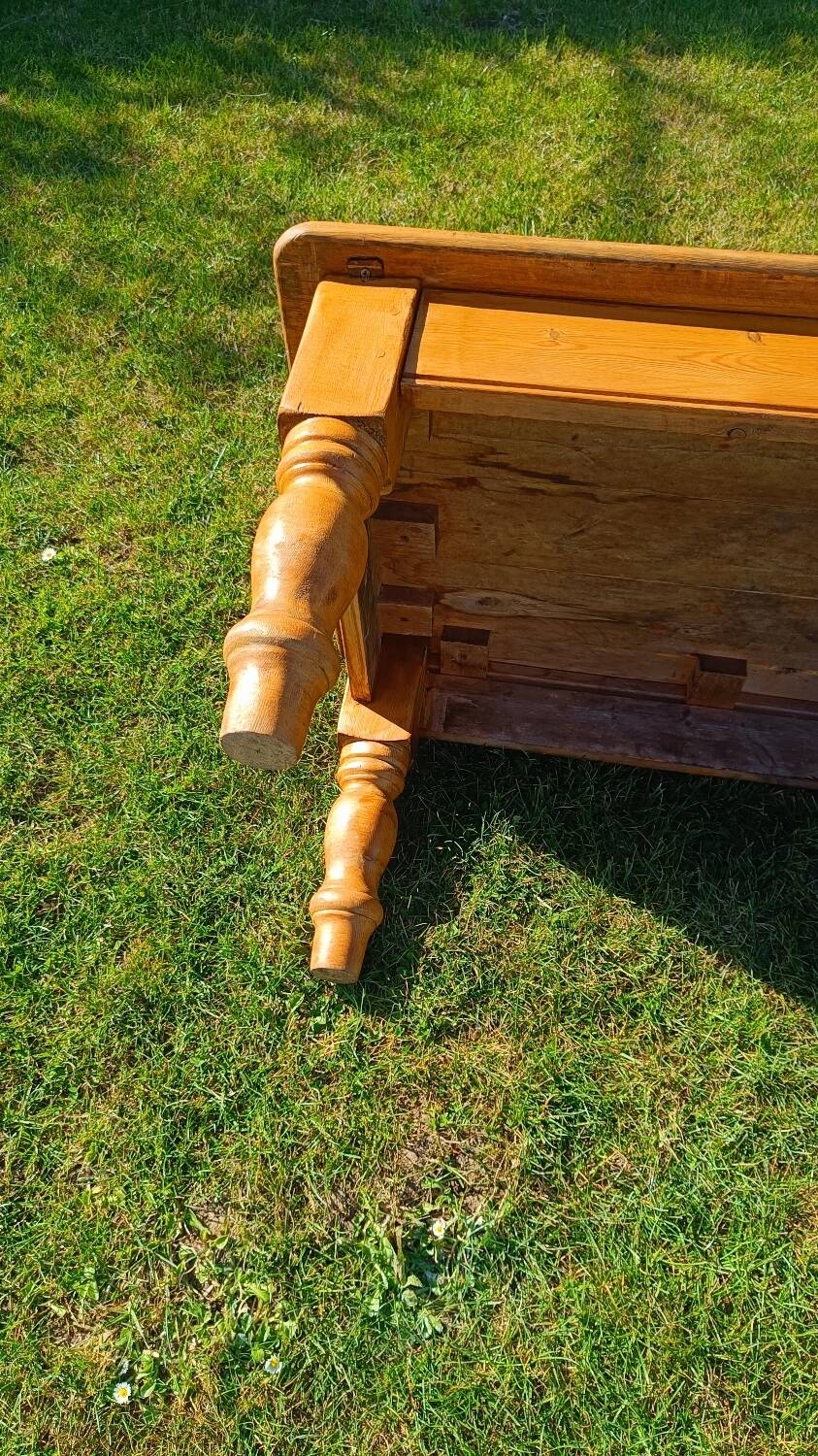Solid oak coffee table with turned legs.