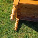 Solid oak coffee table with turned legs.