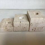 Trio of travertine candlesticks